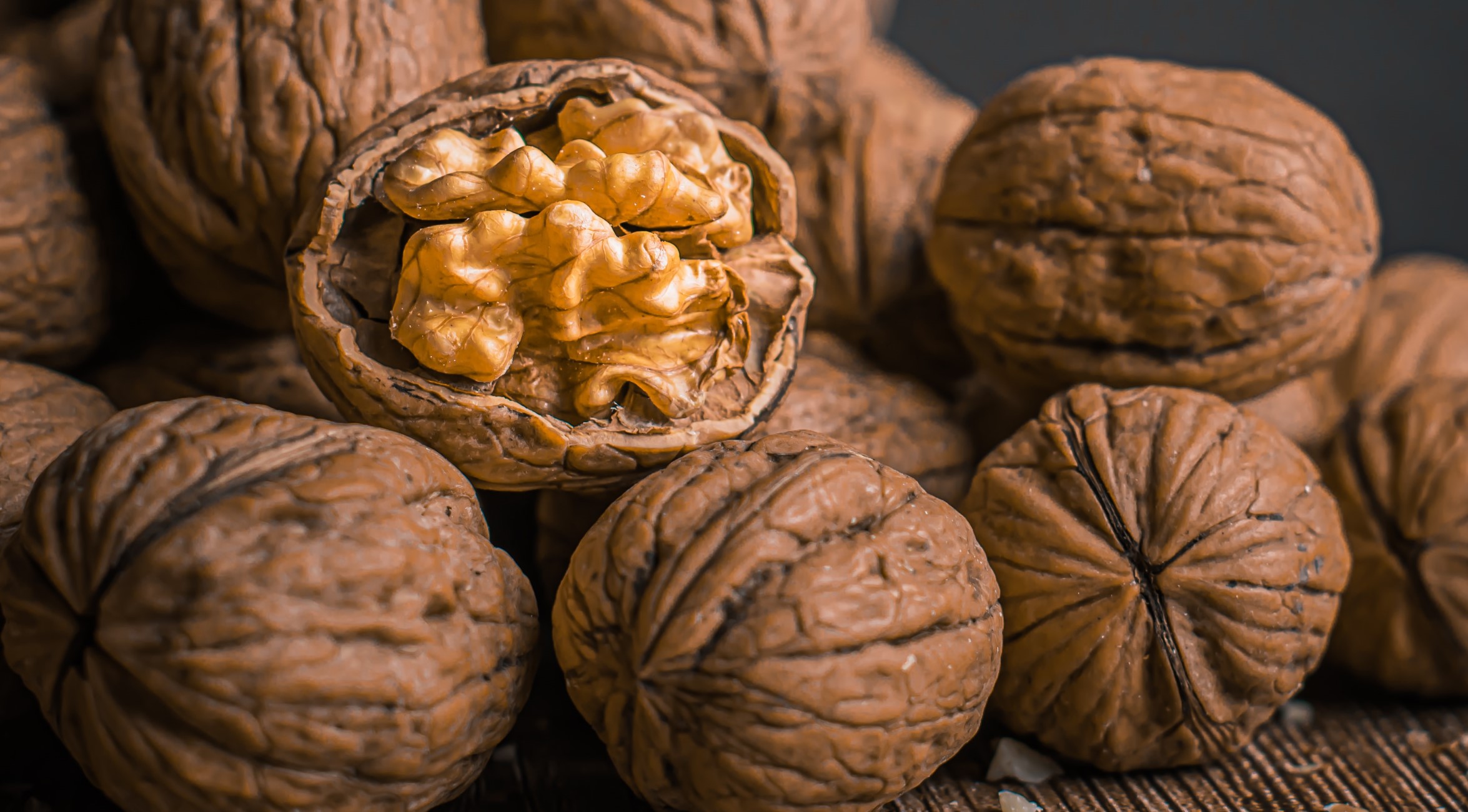 Close-up photo of walnuts on a dark background